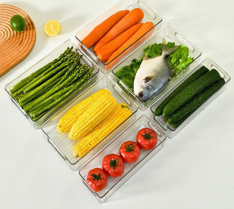 Several bins arranged with vegetables and fish