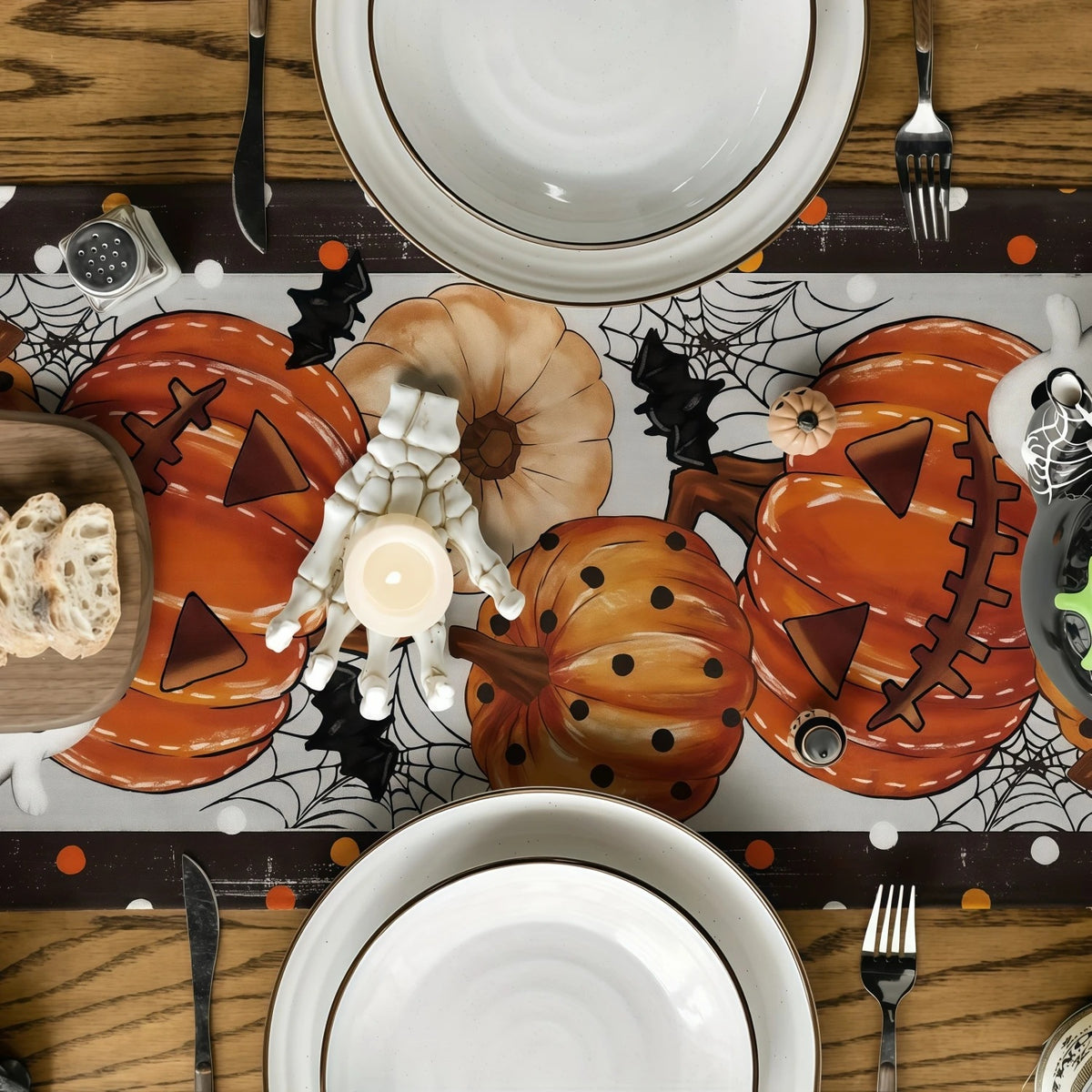 Pumpkins and bats runner on a set table