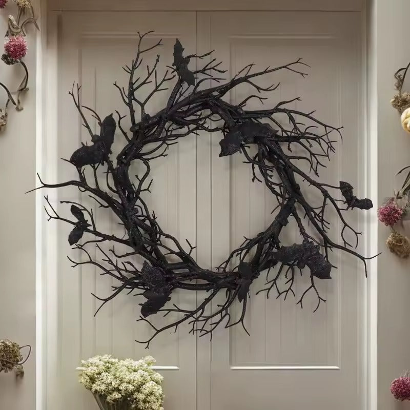 Black twig bat wreath hanging on a front door